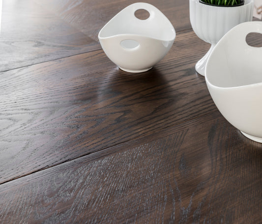 White ceramic bowls on a Homestead House Chocolate wooden surface stained with Milk Paint