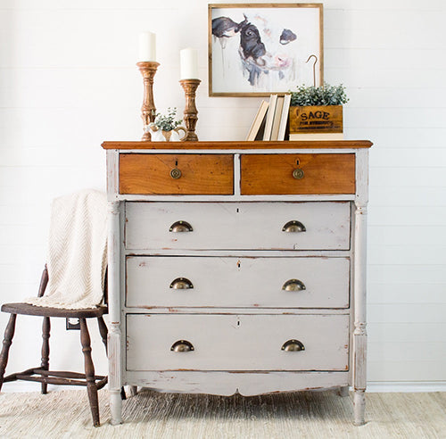 Wooden dresser with Cathedral Taupe homestead House Milk Paint base and feature old oak top drawers in a room setting with decor items.