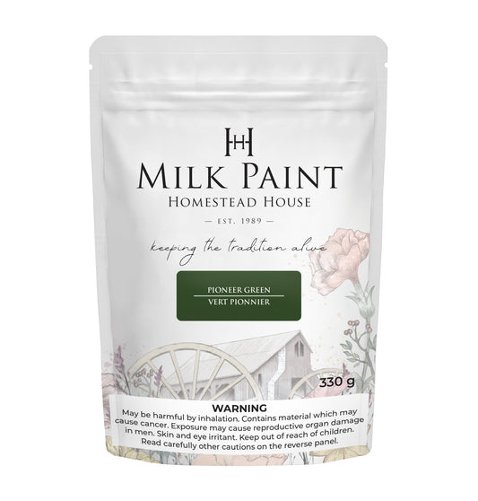 Packaging of Pioneer Green Homestead House Milk Paint with floral design and text on a white background