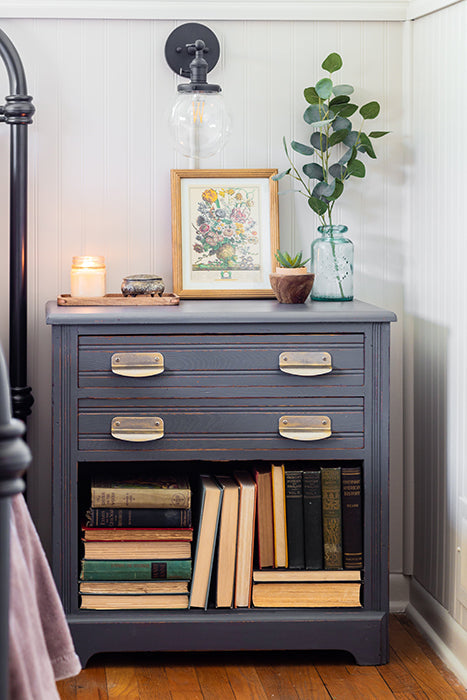 Homestead House Homestead Grey bookcase with books, a plant, and framed picture in a room setting.