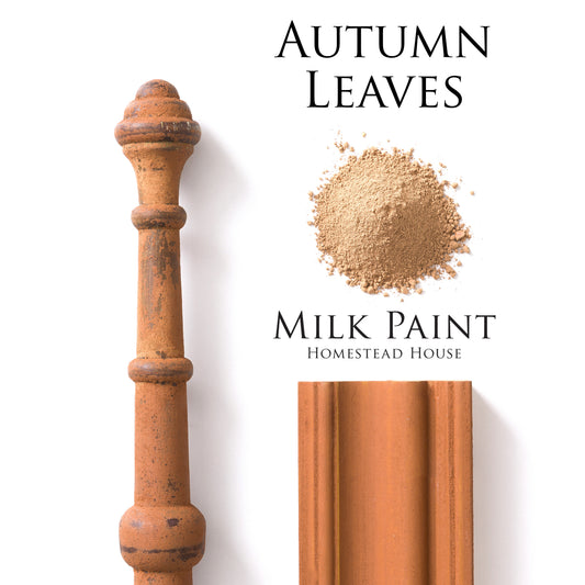 Autumn leaves Homestead House Milk Paint flatlay with milk paint powder, painted trim and distressed spindle