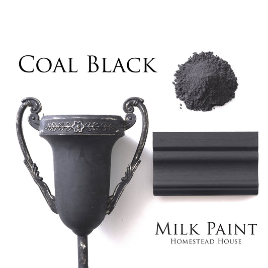 Coal Black milk paint decorative vase, milk paint powder and paint trim sample on a white background