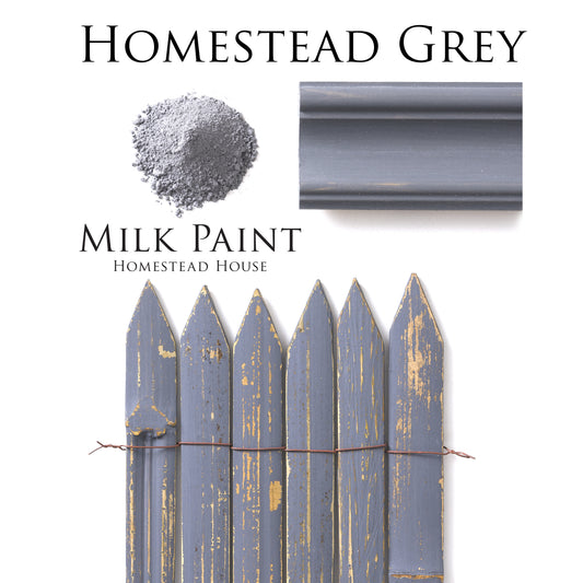 Homestead Grey Homestead House Milk Paint flatlay with milk paint powder, painted trim and distressed fence sample