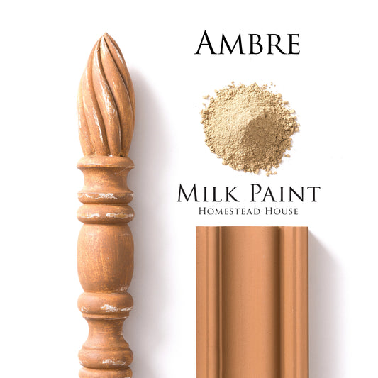 Ambre milk paint by Homestead House with a wooden finial, sample, and painted wood panel on a white background.