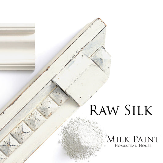 White distressed moulding with a scoop of raw silk milk paint on a white background, featuring the brand 'Homestead House'.