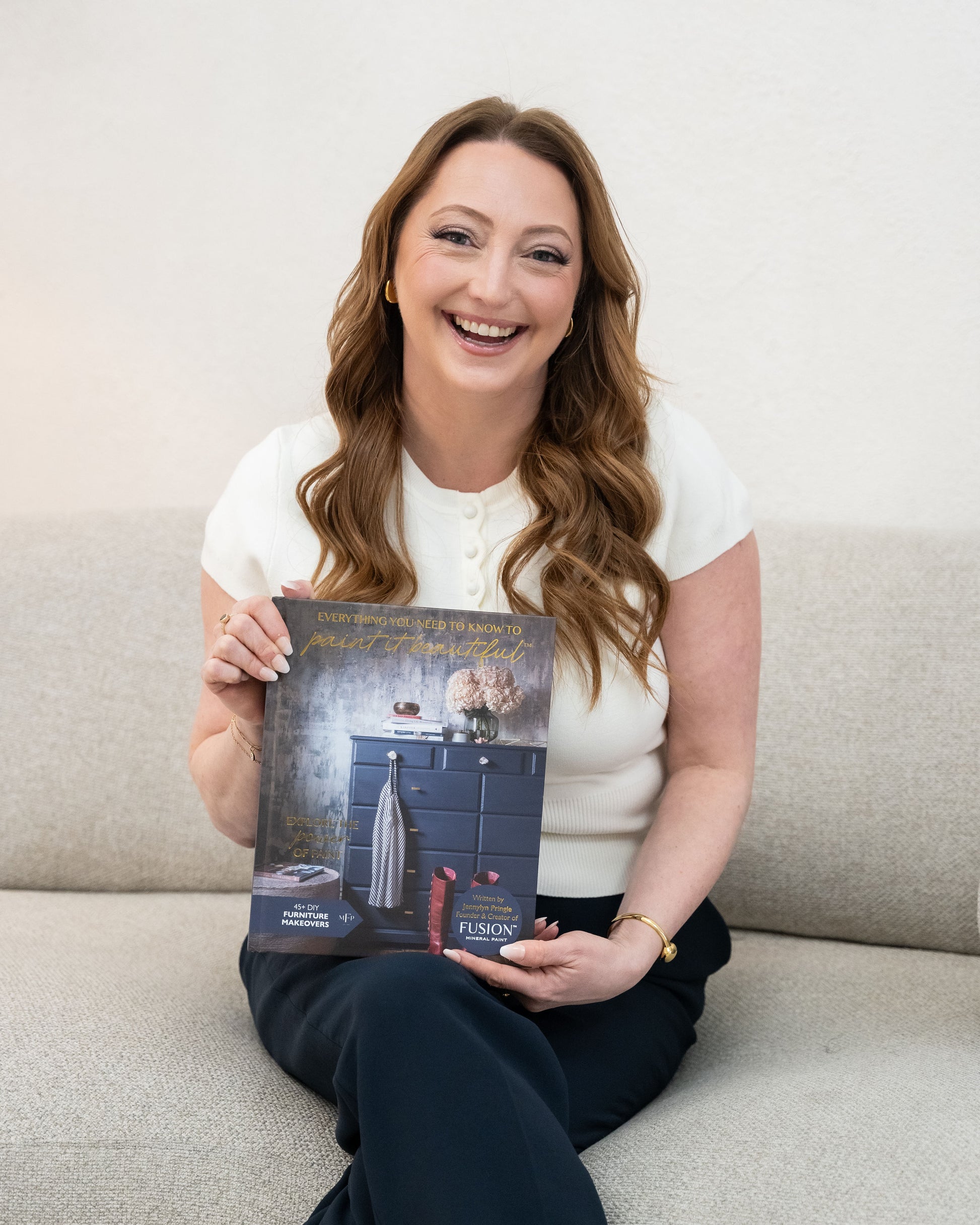 Jennylyn holding her new furniture upcycling book