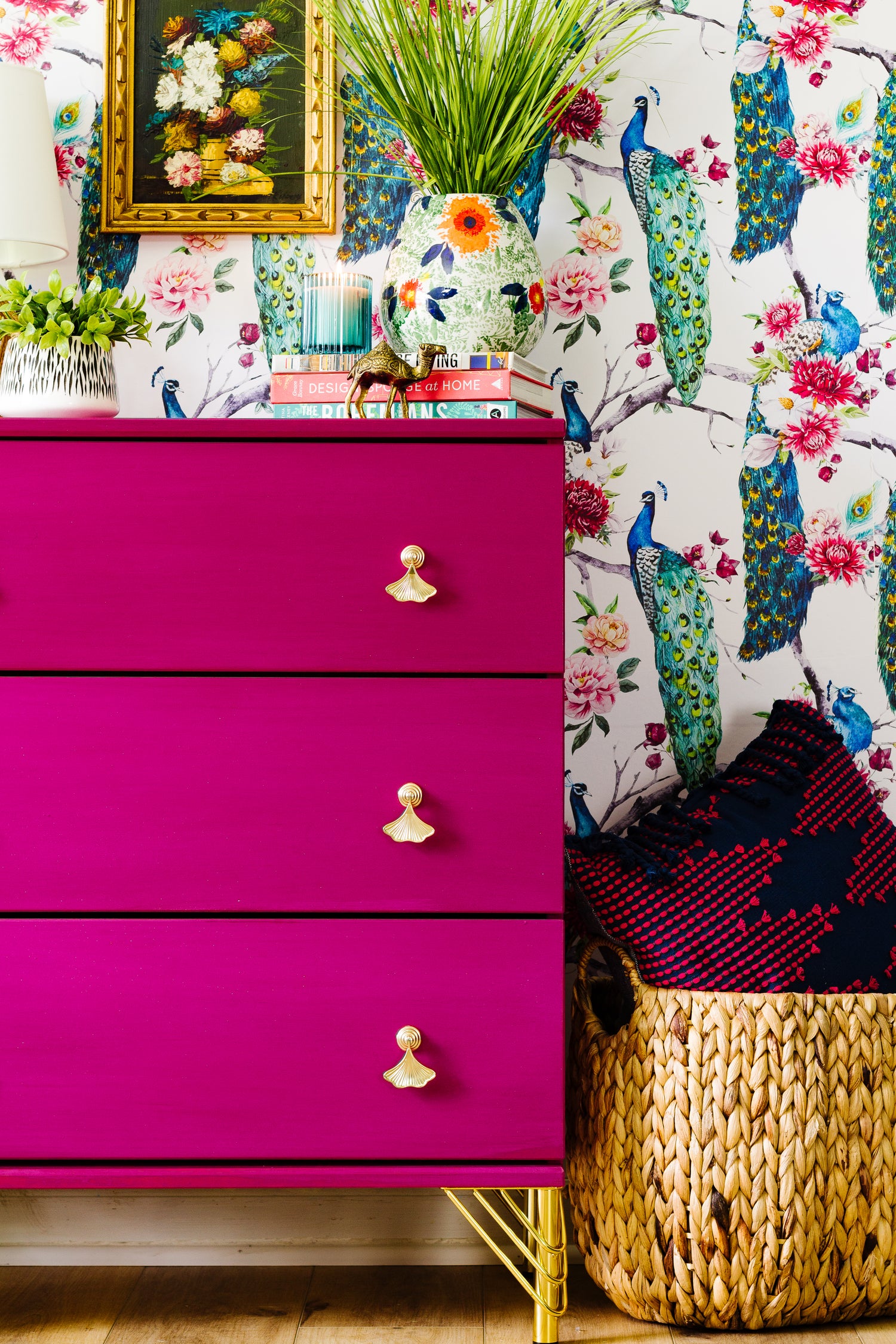 Homestead House Beret colorful dresser with floral wallpaper and decorative items in a room.