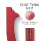 Fort York Red milk paint trim sample, with milk paint powder and sandedcback patterned moulding and Homestead House branding on a white background