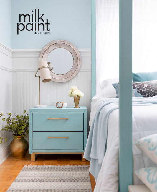 Beach vibe bedroom with modern square bedside table painted in Amalfi Coast Milk Paint by Fusion