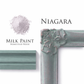 Niagara homestead House milk paint flat lay with decorative frame, painted trim and Milk Paint powder on a white background