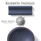 Kurbits Indigo homestead House Milk Paint flat lay with milk paint powder, painted trim and distressed painted wooden bowl