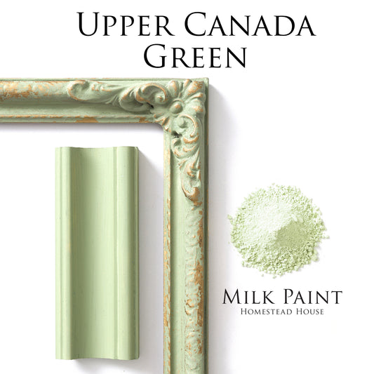 Green milk paint sample with decorative frame and 'Upper Canada Green' text on a white background.