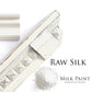 White distressed moulding with a scoop of raw silk milk paint on a white background, featuring the brand 'Homestead House'.